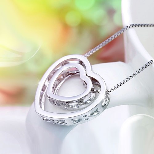 Solid silver cut out heart pendant ‘two hearts make one’